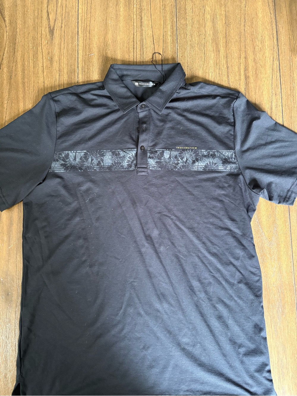 Travis Mathew Black Short-Sleeve Polo with Subtle Tonal Stripe